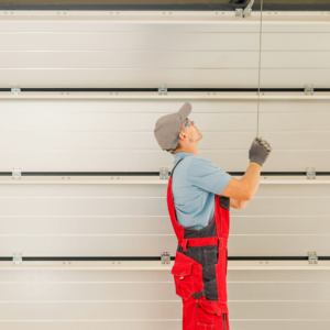 professional making measurements while installing a garage door