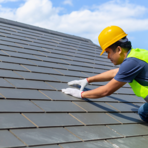 professional installing shingles on a roof